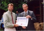 Terry receives a certificate on behalf of the Trustees of Stinchcombe Hill Recreation Ground Trust.